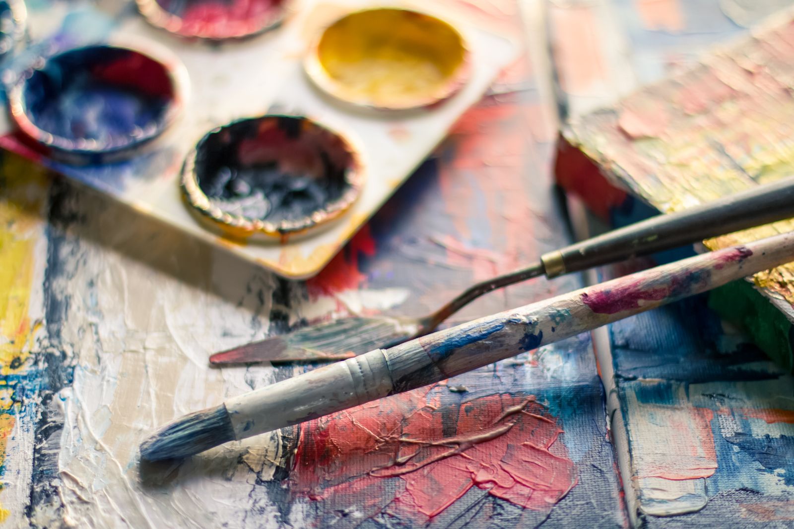 A painter's palette with brushes and paint